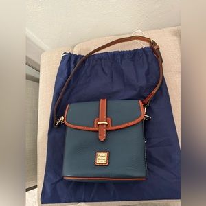 Dooney and Bourke Pebble Grain Holly Bag. Color: blue with brown trim.